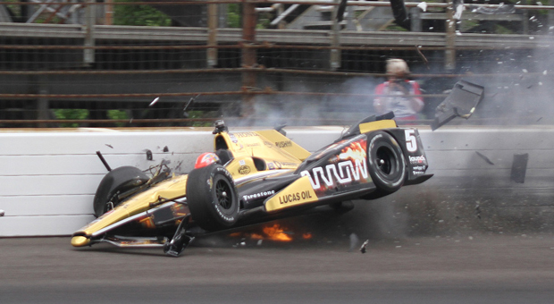 James Hinchcliffe, of Canada, hits the wall in the third turn during practice for the Indianapolis 500 auto race at Indianapolis Motor Speedway in Indianapolis, Monday, May 18, 2015.  (Jimmy Dawson/The Indianapolis Star via AP) ORG XMIT: ININS101