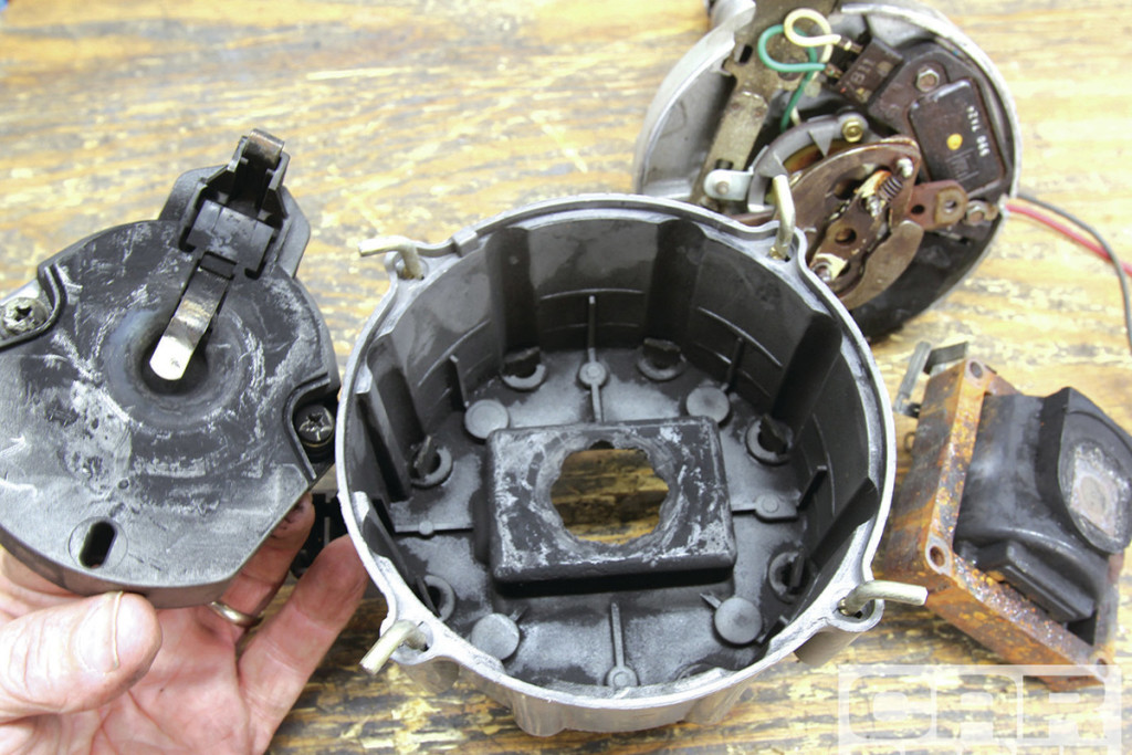This image shows a cap and rotor that is in dire need of being changed. Pitting on the cap and rotor terminals can easily be seen.