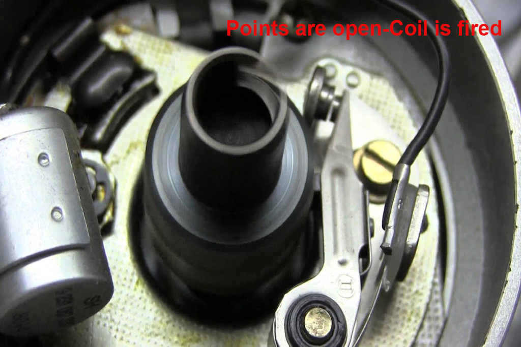 This image shows an eight cylinder distributor with the points open. The coil has just fired or is firing.