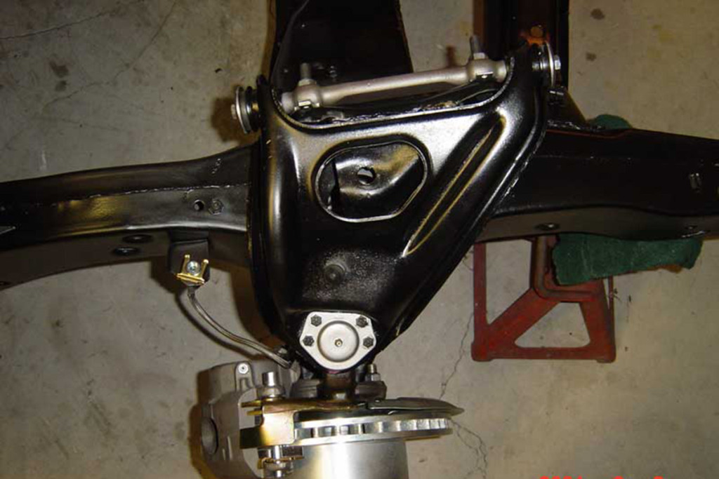 The control arm and shims on a First Gen Camaro.