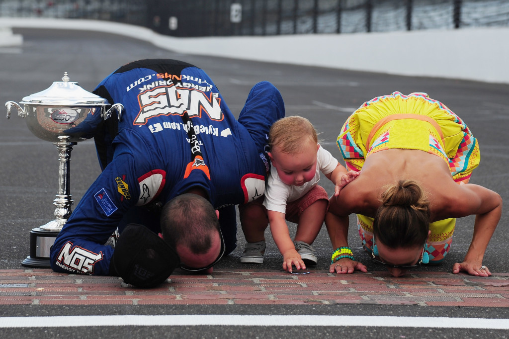 INDIANAPOLIS, IN - JULY 23:  Kyle Busch, driver of the #18 NOS Energy Drink Toyota, celebrates with his wife, Samantha, and son, Brexton, after winning the NASCAR XFINITY Series Lilly Diabetes 250 at Indianapolis Motor Speedway on July 23, 2016 in Indianapolis, Indiana.  (Photo by Jeff Curry/NASCAR via Getty Images)