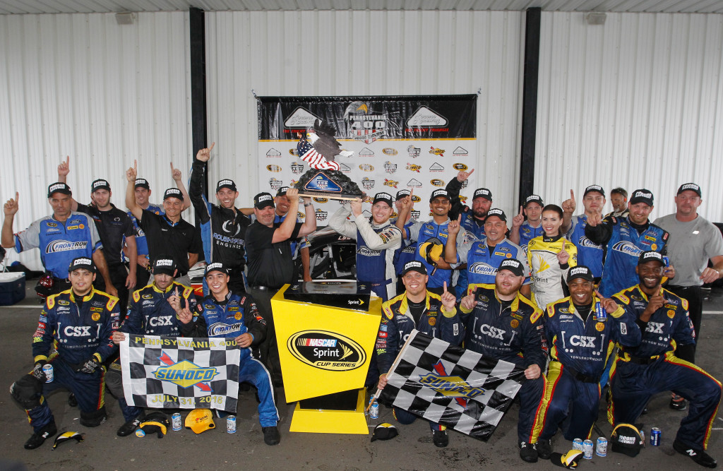  Chris Buescher, driver of the #34 Dockside Logistics Ford, celebrates in victory lane after winning the NASCAR Sprint Cup Series Pennsylvania 400 at Pocono Raceway on August 1, 2016 in Long Pond, Pennsylvania. The race was delayed due to inclement weather on Sunday, July 31.  (Photo by Brian Lawdermilk/Getty Images)