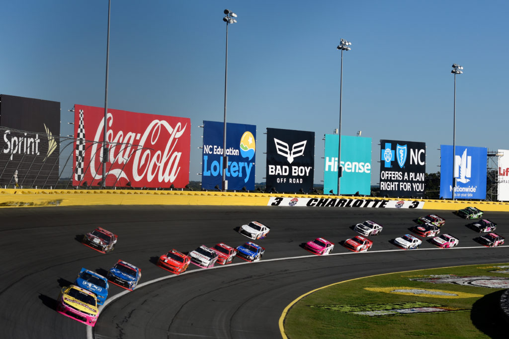 Kyle Larson leads a pack of cars.  (Photo by Jared C. Tilton/NASCAR via Getty Images)