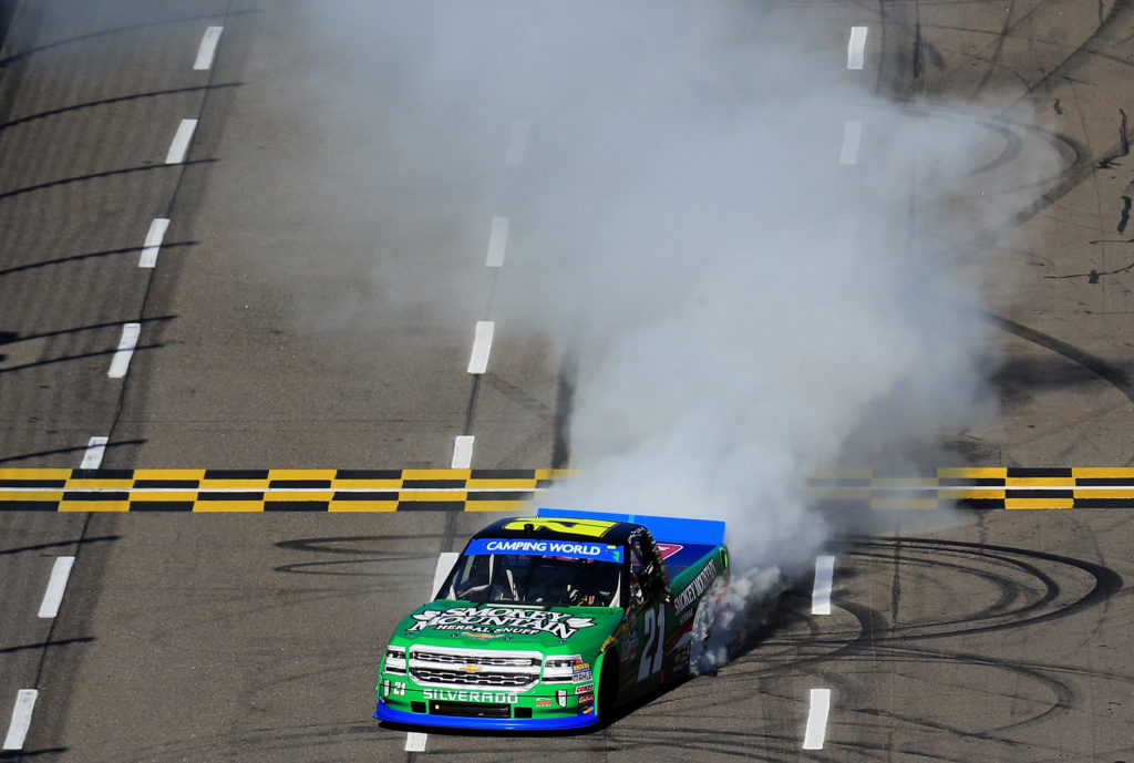 Johnny Sauter celebrates with a burnout.  (Photo by Daniel Shirey/Getty Images)