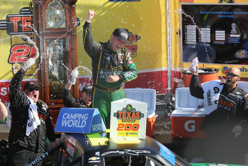 Johnny Sauter celebrates in Victory Lane.  (Photo by Jerry Markland/Getty Images)