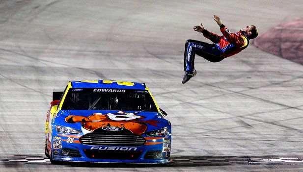 BRISTOL, TN - MARCH 16: Carl Edwards, driver of the #99 Kellogg's/Frosted Flakes Ford, celebrates with a backflip after winning the NASCAR Sprint Cup Series Food City 500 at Bristol Motor Speedway on March 16, 2014 in Bristol, Tennessee. (Photo by Brian Lawdermilk/NASCAR via Getty Images)