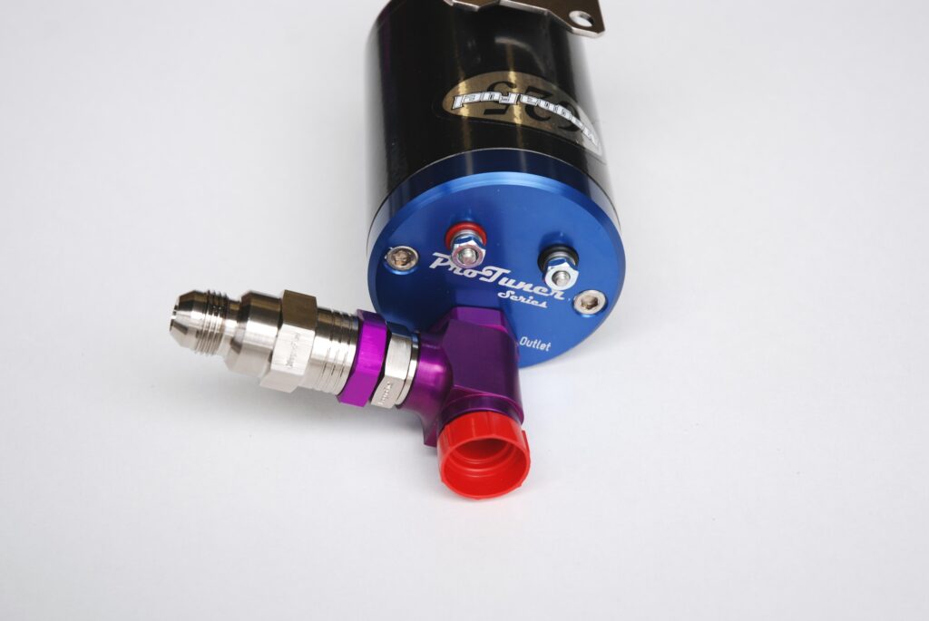 The outlet side of this MagnaFuel pump includes an optional bypass assembly along with wire connections (the wiring is dead simple: red-plus, black-negative).