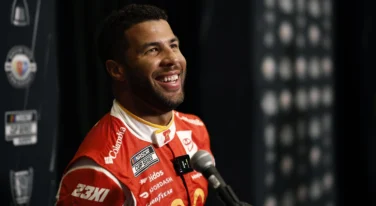 NASCAR Cup Series driver Bubba Wallace speaks with the media during the NASCAR Cup Series Playoff Media Day at Charlotte Convention Center on August 31, 2023 in Charlotte, North Carolina. (Photo by Jared C. Tilton/Getty Images)