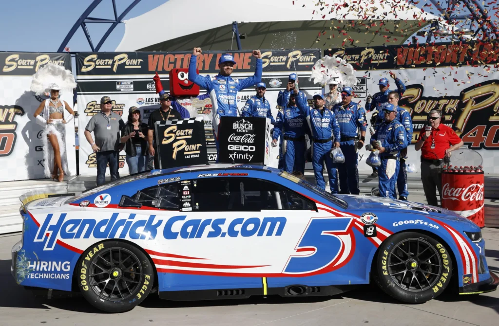 LAS VEGAS, NEVADA - OCTOBER 15: Kyle Larson, driver of the #5 HendrickCars.com Chevrolet, celebrates in victory lane after winning the NASCAR Cup Series South Point 400 at Las Vegas Motor Speedway on October 15, 2023 in Las Vegas, Nevada. (Photo by Chris Graythen/Getty Images)